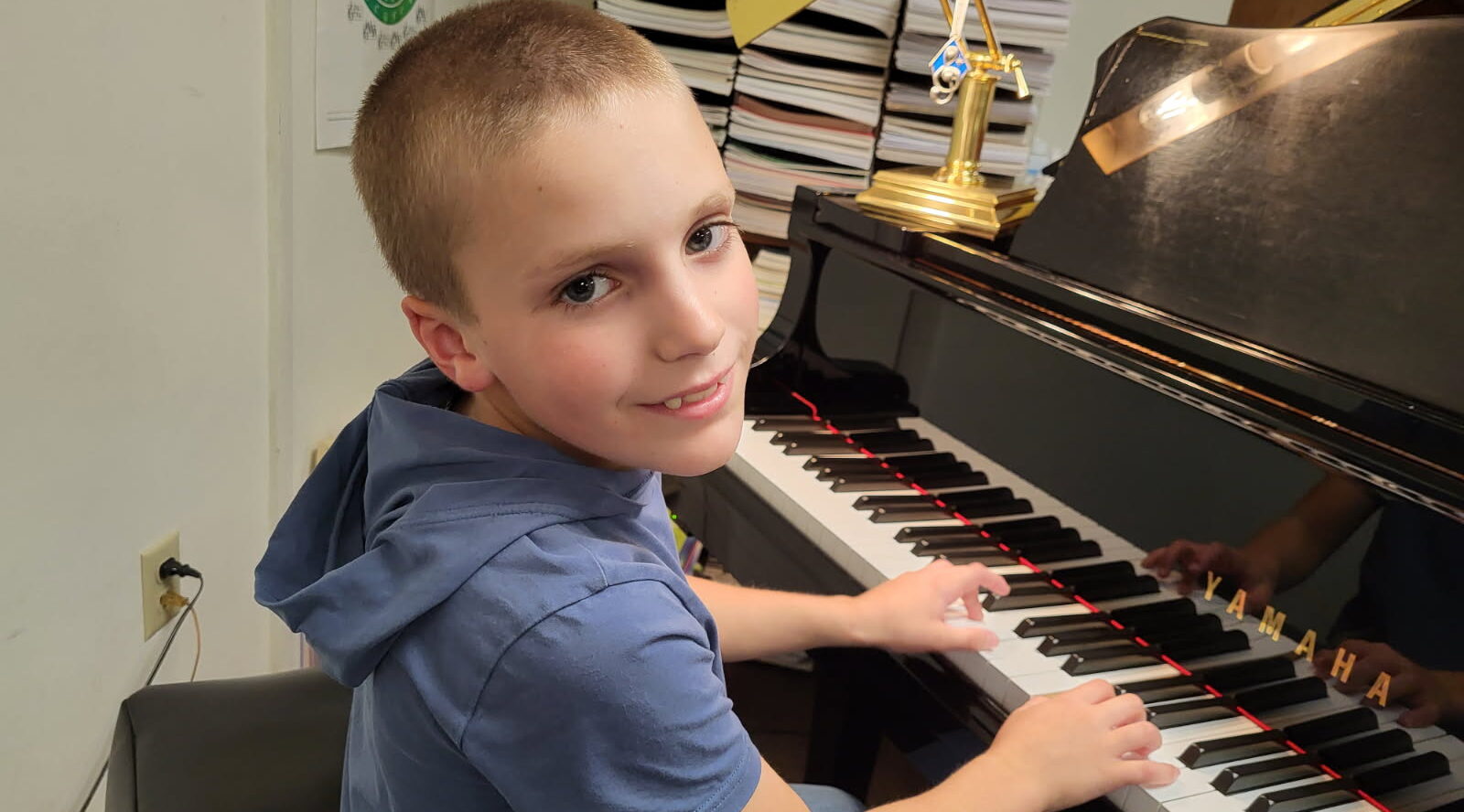 ENGLERT-BOY PIANO STUDENT SMILING 1600X1200 REDUCED TO 54%